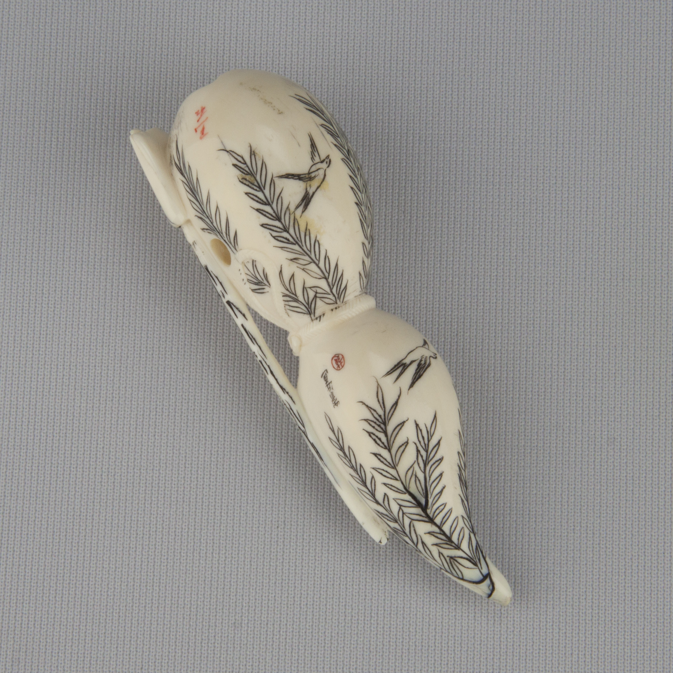 Netsuke depicting a double gourd with stained black designs of willows and birds, ca. 18th–19th century Ivory Gift of Mr. and Mrs. Nathaniel I. Grey 1988.126