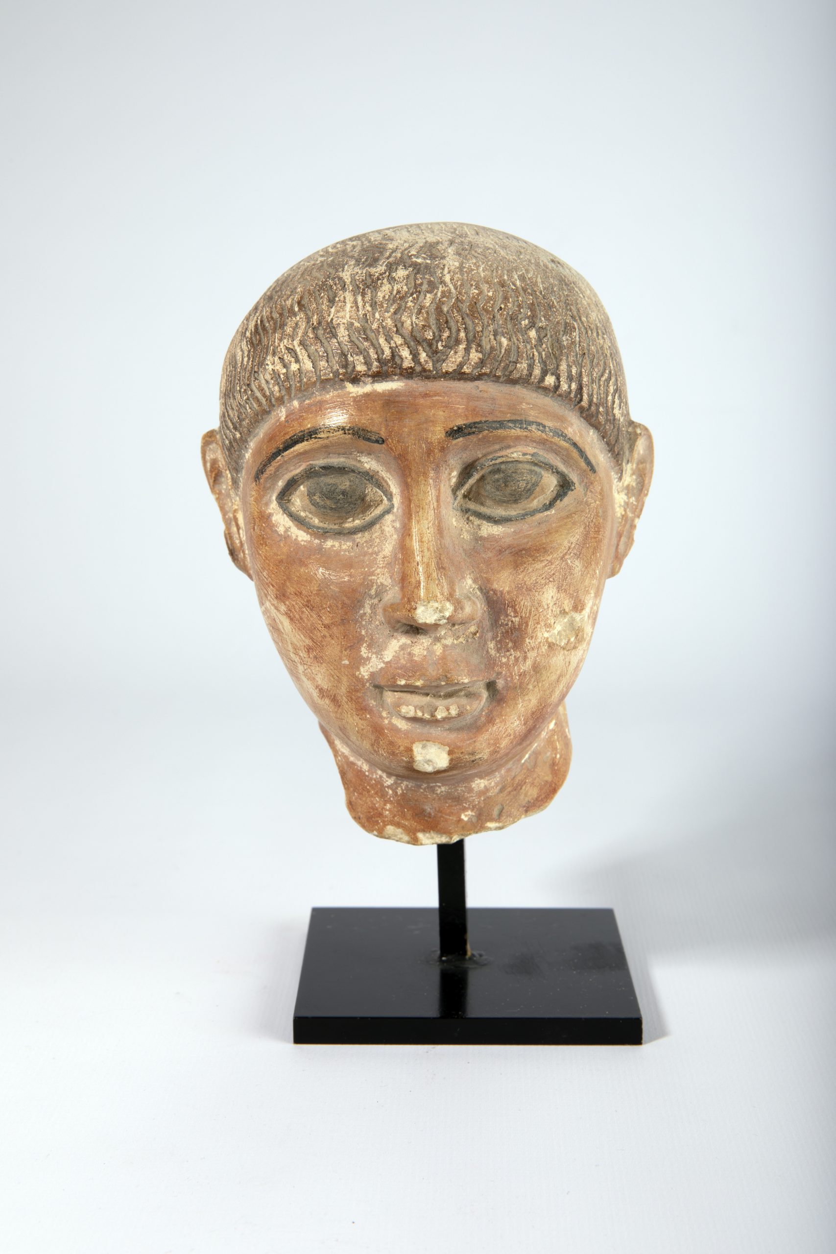 Head of a boy (funerary), Egypt (Coptic), 4–5th century CE, Limestone with Polychrome, 5 ¼ x 5 x 5 ¼ inches, 1979.1012P