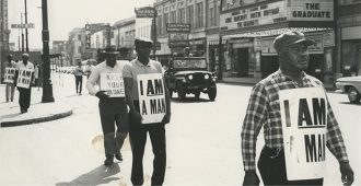 Men marching with protest signs