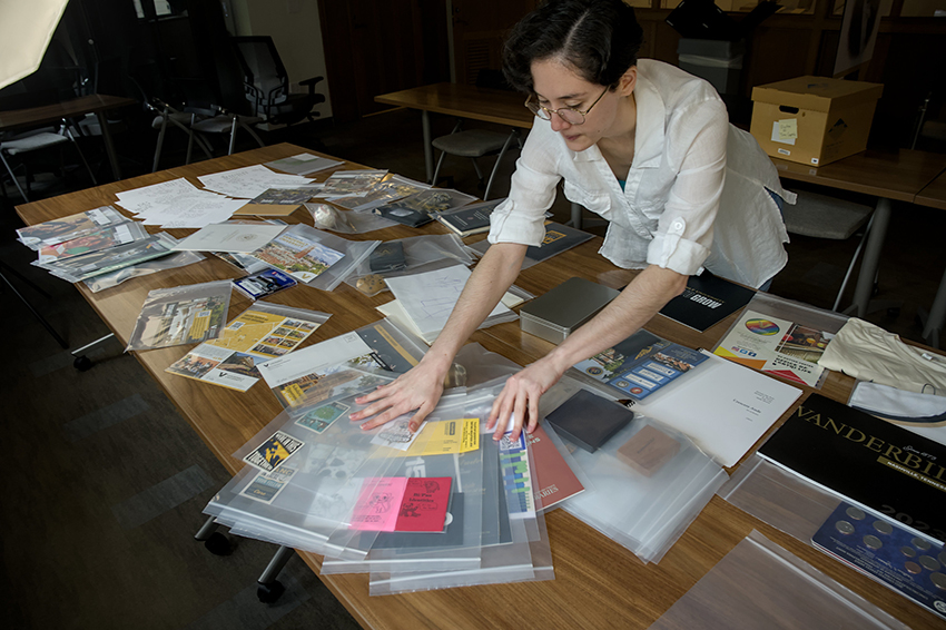 Assistant University Archivist Faith McConnon organizes materials to be included in the time capsule. (Tim Gollins/Vanderbilt)