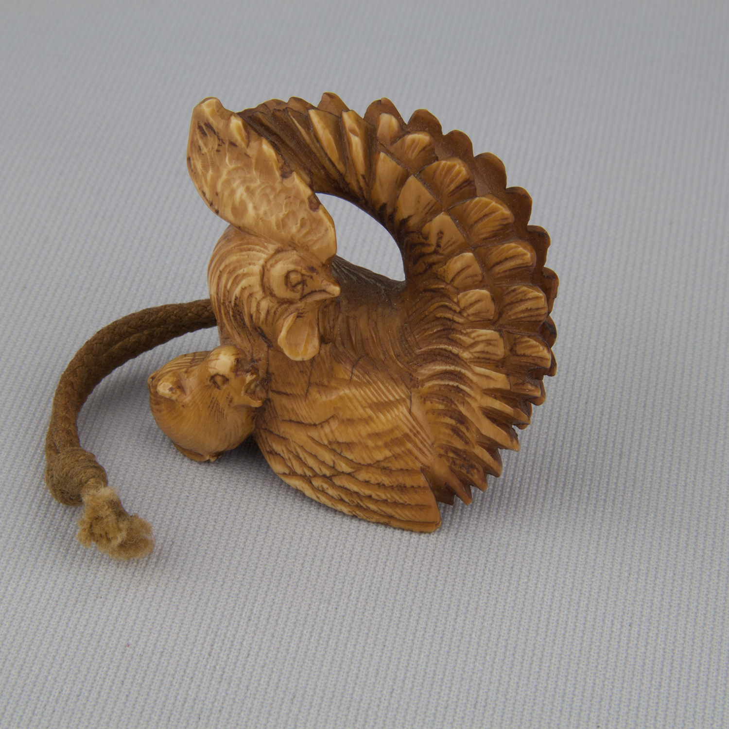 Netsuke depicting a rooster and chick, ca. 18th–19th century, tea-stained ivory, The Herman D. Doochin Collection, 1992.174 