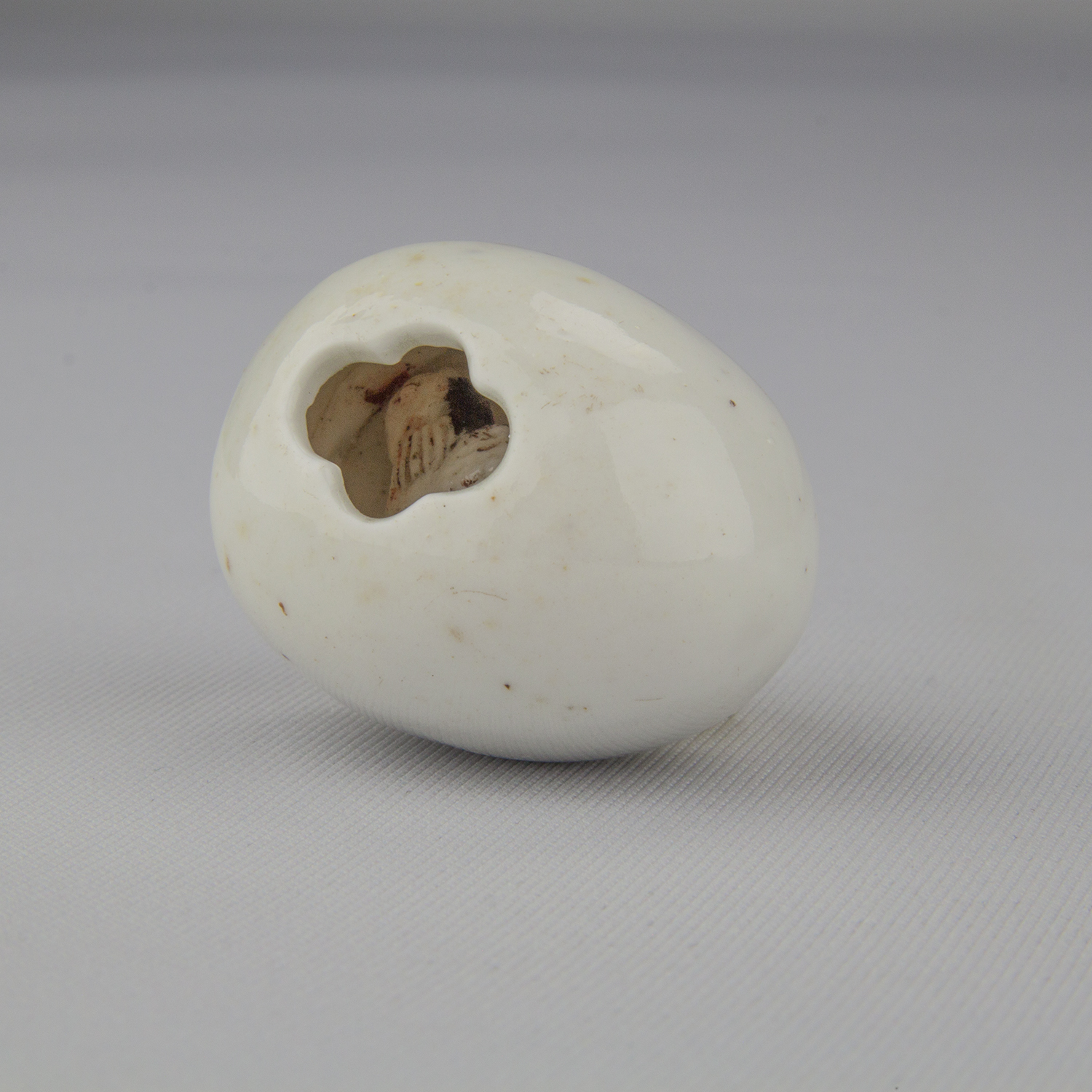 Netsuke depicting a chicken inside of an egg, ca. 18th–19th century, glazed porcelain, The Herman D. Doochin Collection, 1992.160